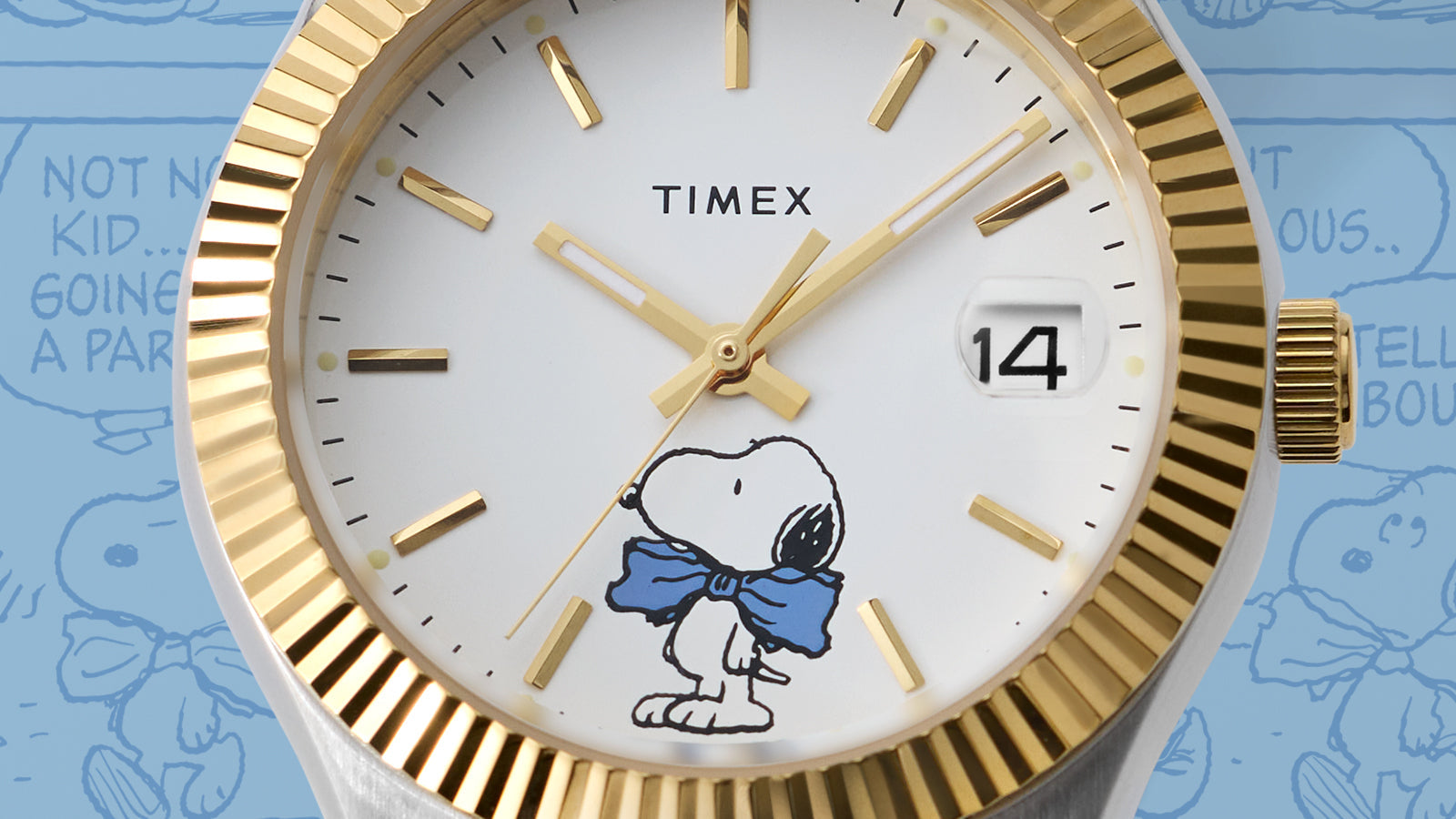 Timex x Peanuts® Timex Legacy watch in silver and gold-tone with white dial and Snoopy in a blue bow tie, displayed against a blue background with Peanuts® comic strip panels.