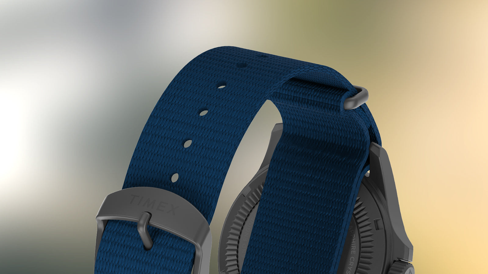 Detailed view of the textured navy fabric strap with matte buckle engraved with “TIMEX,” highlighting rugged durability.