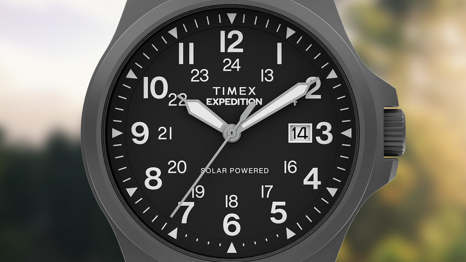 Close-up of the black dial with bold white numerals, luminous hands, 24-hour military time markings, date window at 3 o’clock, and “Solar Powered” marking.