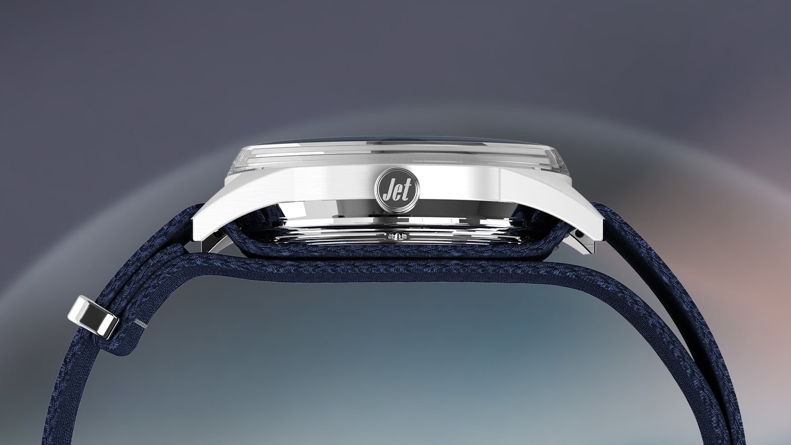 Side profile of the Timex Marlin® Jet Automatic watch, showcasing the polished stainless-steel case engraved with “Jet” and paired with a navy woven strap.