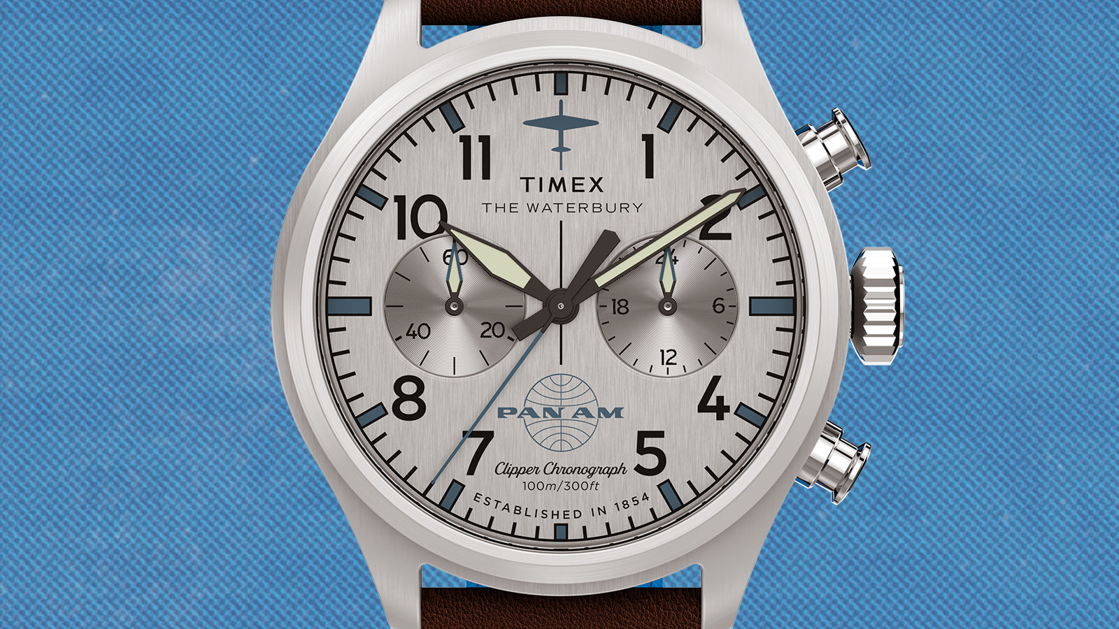 Front view of the Timex x Pan Am® Waterbury Ace Chronograph with silver dial, black markers, chronograph subdials, and Pan Am globe logo.