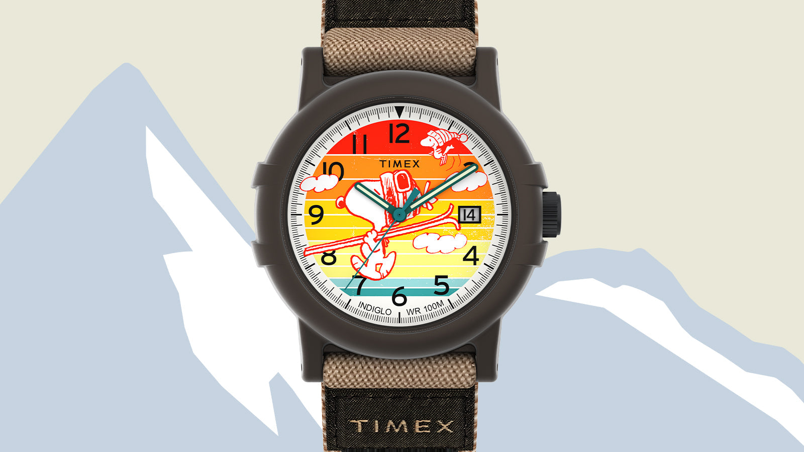 Timex x Peanuts® Camper Ski watch featuring Snoopy skiing on a colorful sunset-striped dial with black numerals and a black resin case. The watch has a tan and black fabric strap with the Timex logo near the lugs.