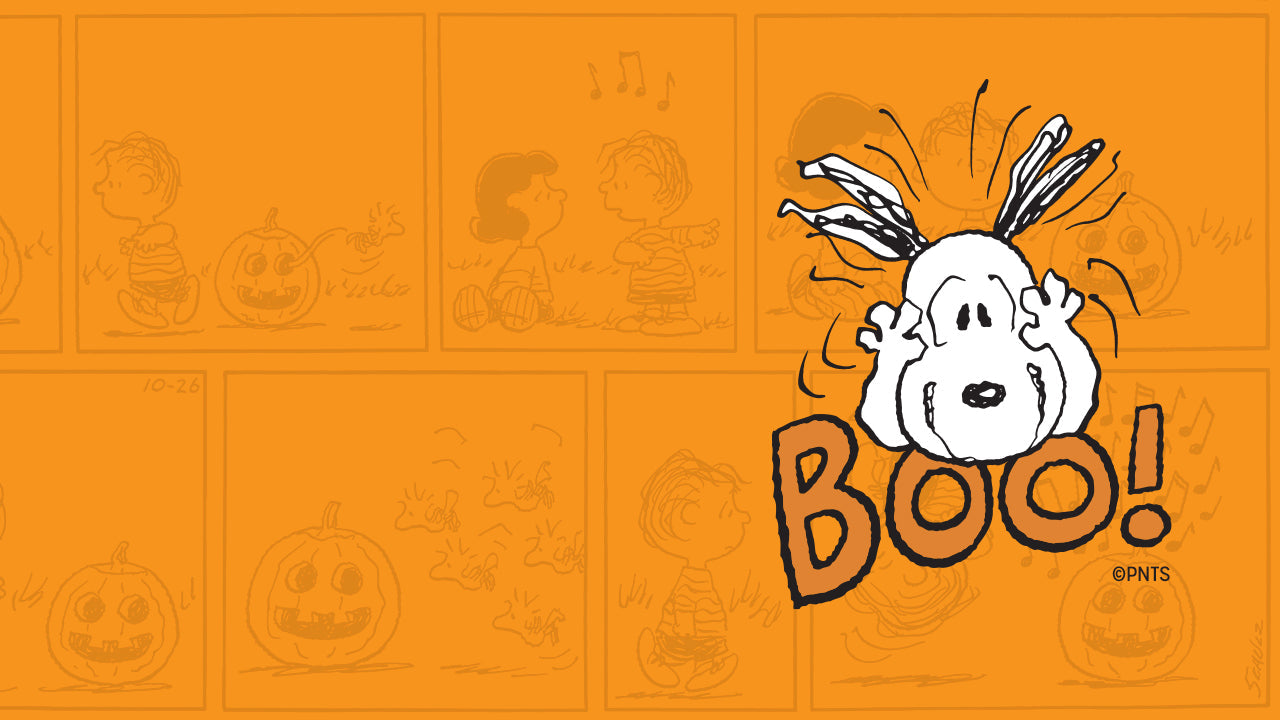 Illustration of Snoopy with ears raised, playfully scaring with the word “BOO!” on an orange background featuring faint Peanuts Halloween comic panels.