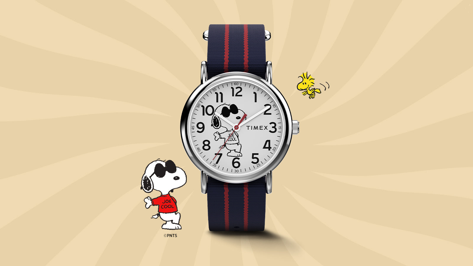 Timex x Peanuts® Weekender watch featuring Snoopy as “Joe Cool” on the dial, paired with a navy and red-striped fabric strap. Displayed on a warm beige background with Snoopy and Woodstock illustrations for a playful, nostalgic look.