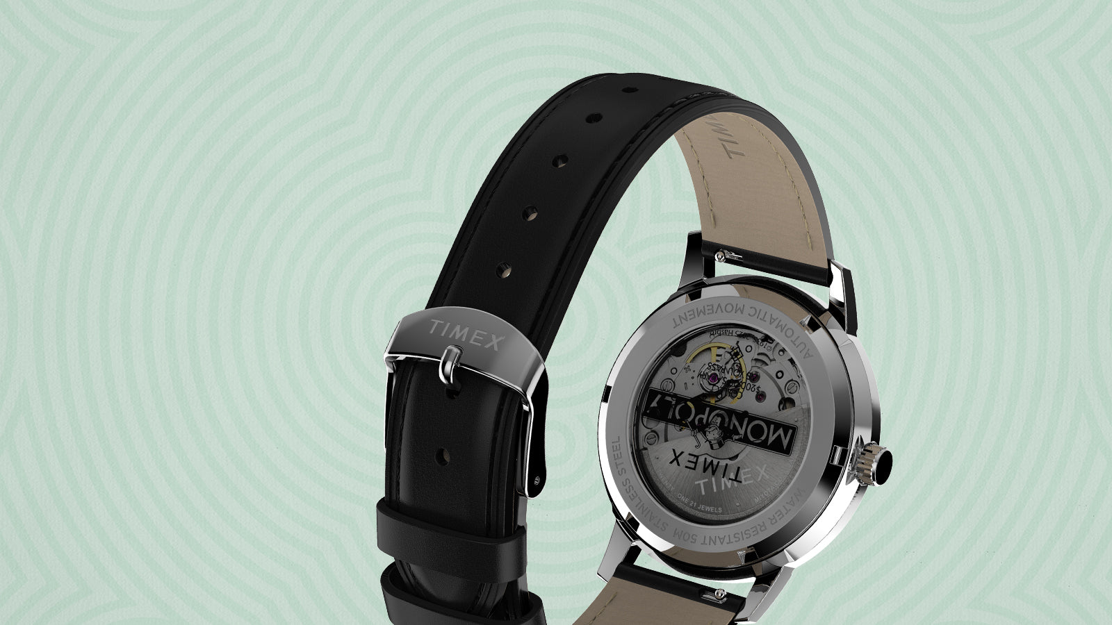 Rear angled view of the Timex x Monopoly Marlin® Automatic watch showing its black leather strap, polished buckle engraved with the Timex logo, and see-through case back displaying the Monopoly-themed automatic movement.