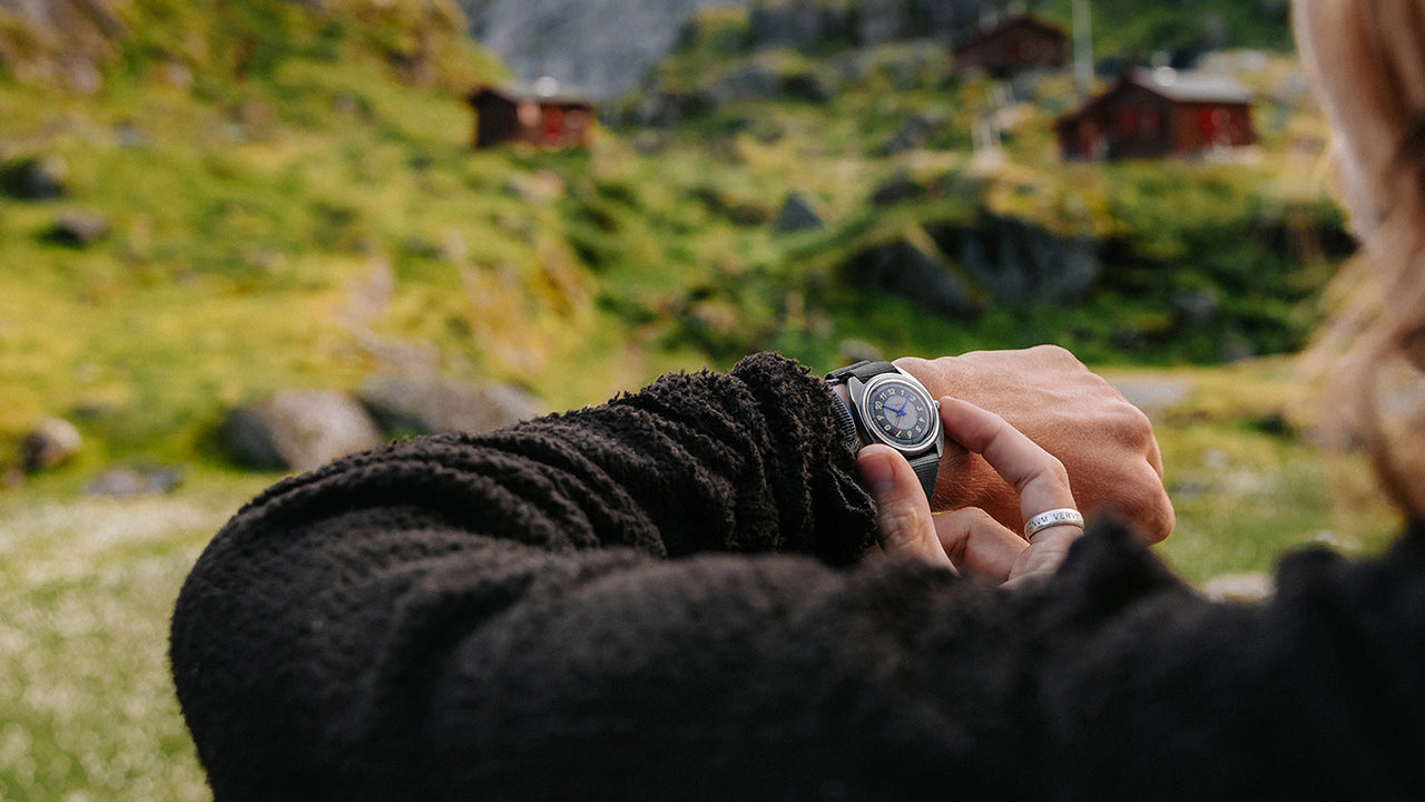 A close-up of the gray strap on the Timex x Worn & Wound Storm, showing stitching, keepers, and texture against a rope background.