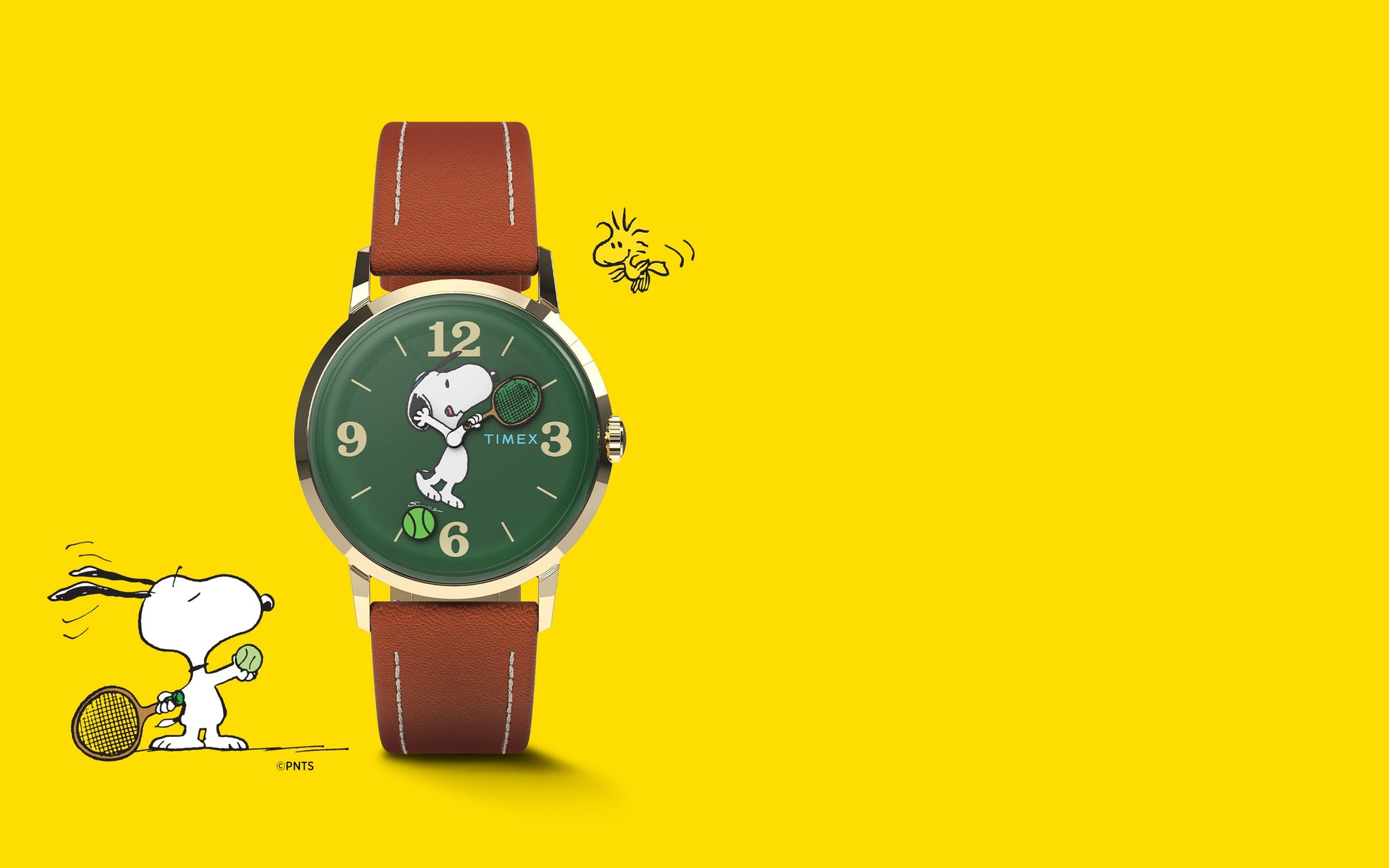 A Timex Marlin® Hand-Wound x Snoopy Tennis watch with a green dial and brown leather strap set against a bright yellow background. The dial features Snoopy holding a tennis racket, with a tennis ball design near 6 o’clock, celebrating the Peanuts tennis theme.