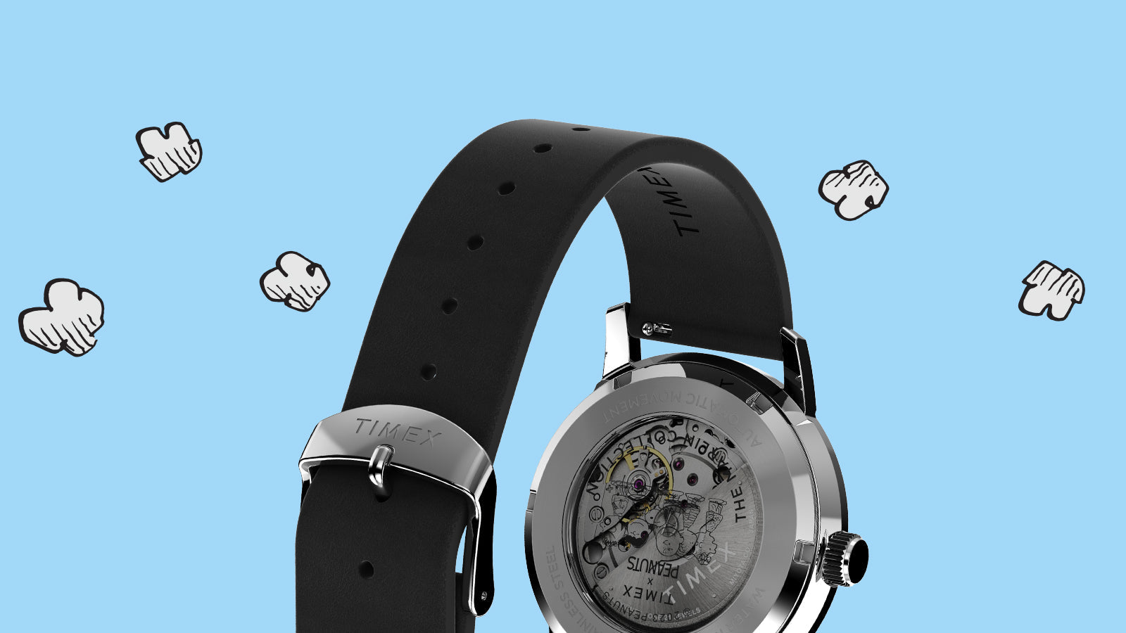 Back view of the Timex Marlin® Automatic x Peanuts Snoopy Flying Ace watch focusing on its black leather strap and silver buckle. The open caseback displays the engraved Peanuts characters and automatic movement within a polished stainless-steel case.