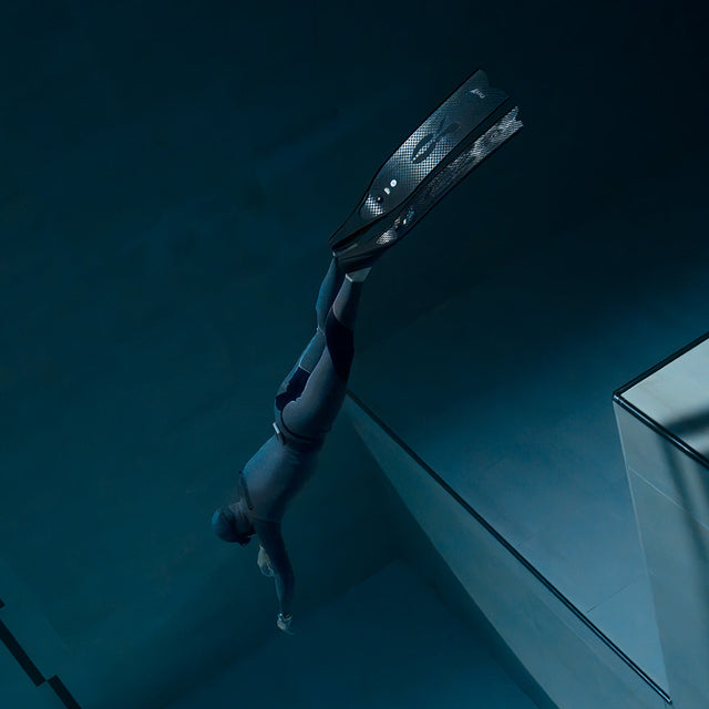 Freediver captured underwater wearing the Timex Deepwater Reef 200, demonstrating its 200-meter water resistance and functionality in deep diving conditions.