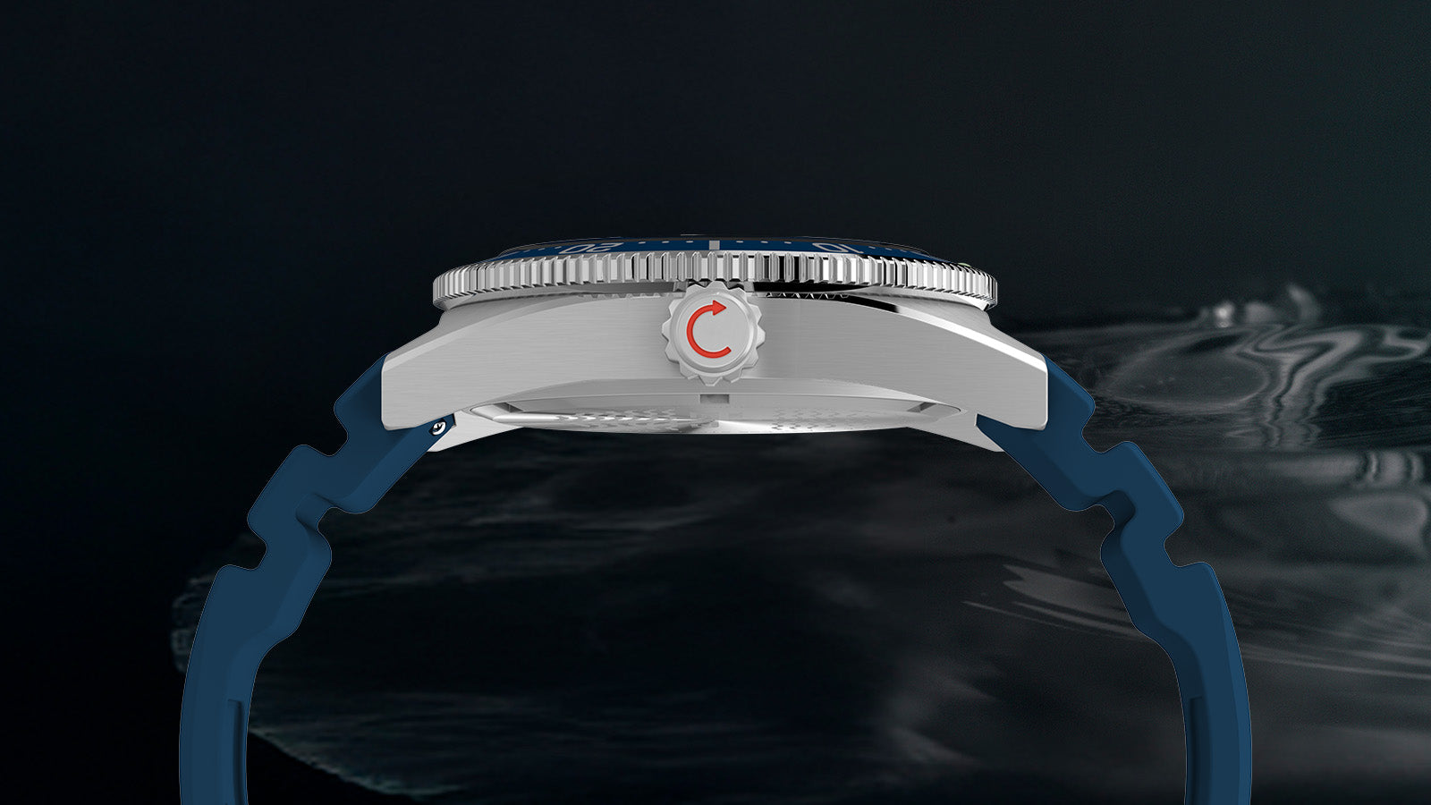 Side profile of the Timex Deepwater Reef 200 watch showing its brushed stainless steel case, screw-down crown with red detailing, and rugged blue silicone strap.