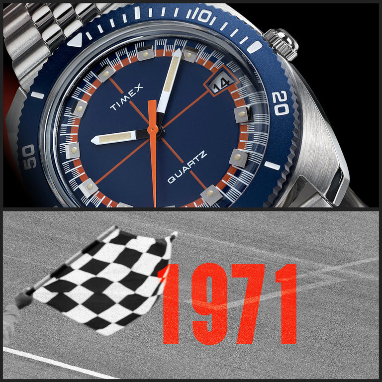 Close-up of the Q Timex® 1971 Velocity dial showing blue and orange detailing, paired with a checkered flag and bold red “1971” text, symbolizing racing heritage.