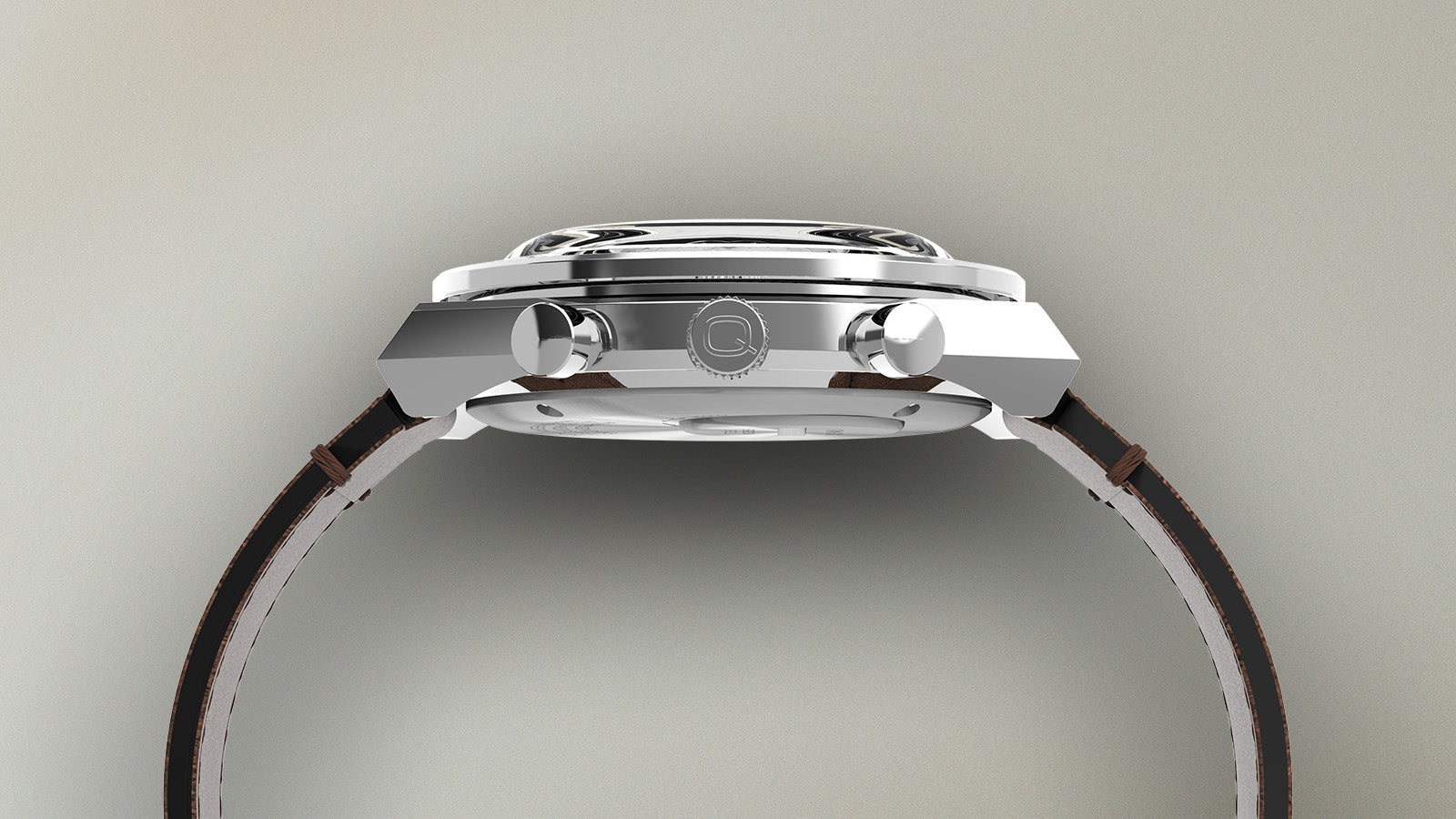 Side profile of the Q Timex Chronograph watch showcasing its stainless steel case, domed crystal, and chronograph pushers.