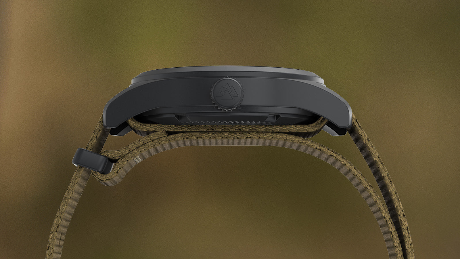 Side profile of the Timex Expedition Field Post Solar watch showing its matte black case, crown with embossed mountain logo, and khaki fabric strap.