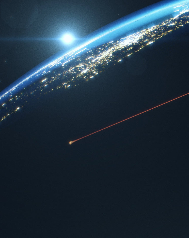 Dramatic image of Earth from orbit at sunrise with a bright horizon glow, a streaking red light tracing across space.
