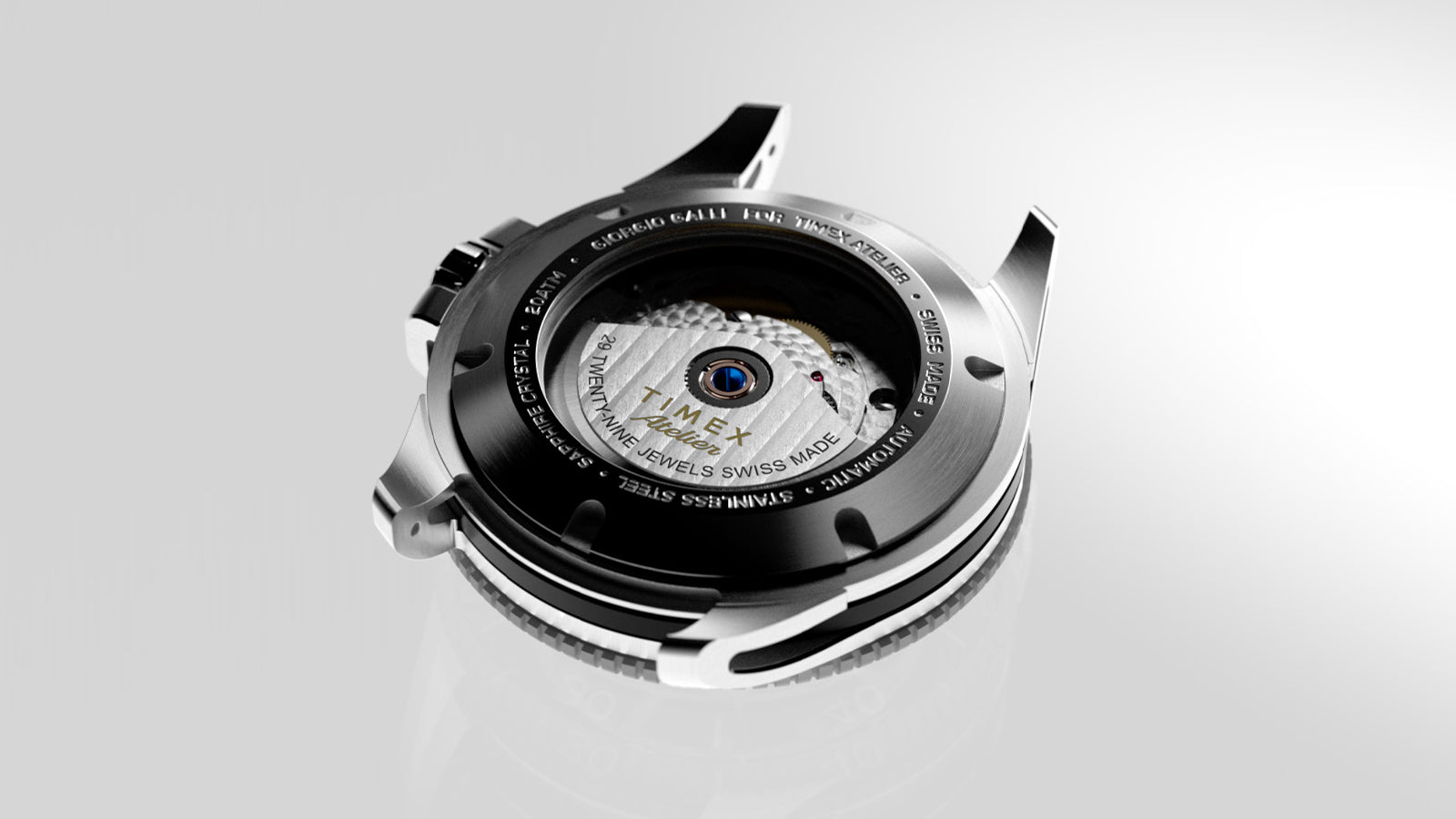 Transparent caseback of the Timex Atelier automatic watch showcasing Swiss automatic movement with “TIMEX Atelier” engraving and 29-jewel detail.