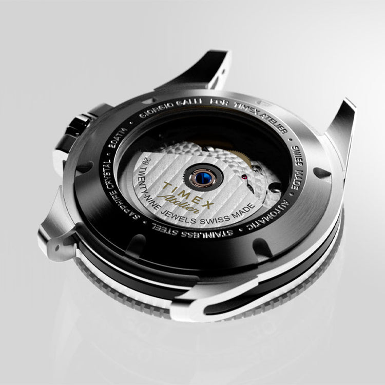 Caseback view of the Timex Atelier automatic watch, revealing its Swiss-made 29-jewel movement through a sapphire crystal exhibition window.