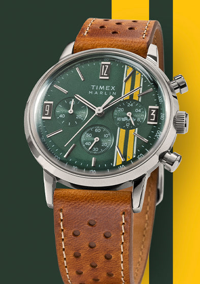 Timex Marlin Chronograph Tachymeter with green dial, yellow stripes, and brown perforated strap displayed against a green and yellow background.