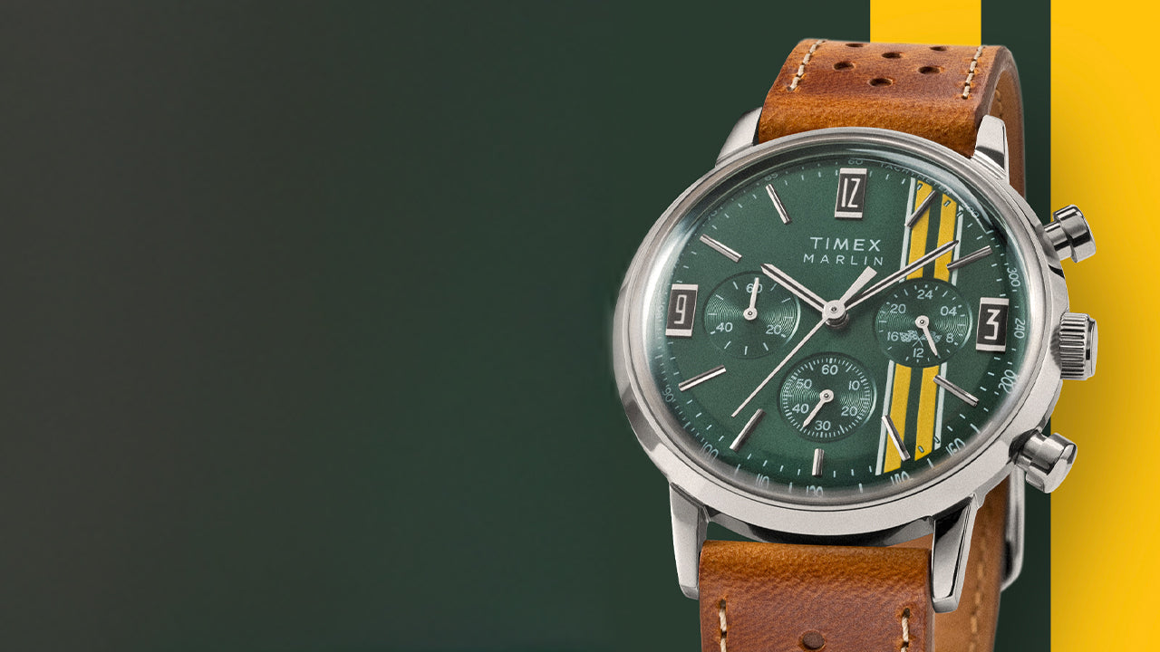 Timex Marlin Chronograph Tachymeter with green dial, yellow stripes, and brown perforated strap displayed against a green and yellow background.