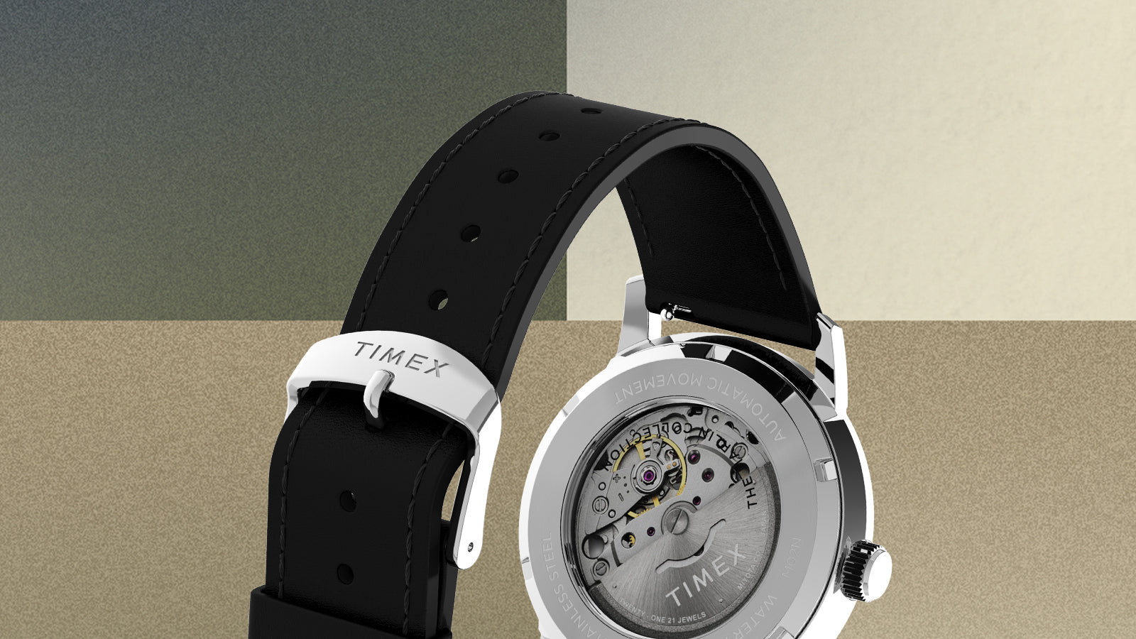 Rear angle of Timex Marlin Automatic watch highlighting stainless-steel exhibition caseback and black leather strap with Timex buckle.