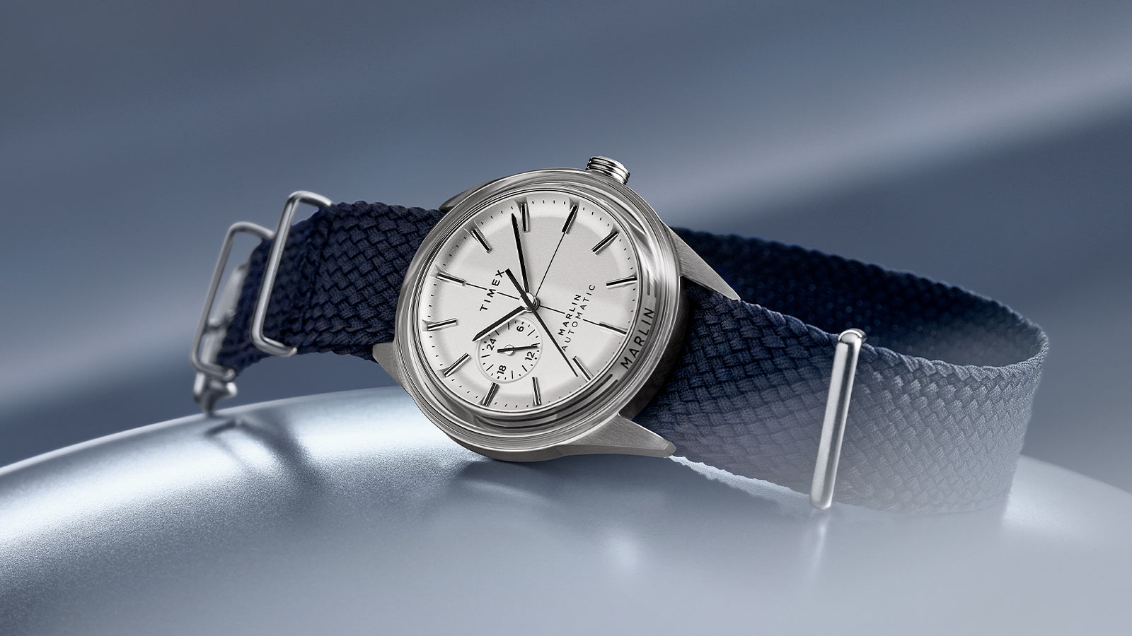 Angled view of Timex Marlin Jet Automatic highlighting polished case, minimalist markers, and MARLIN engraving.