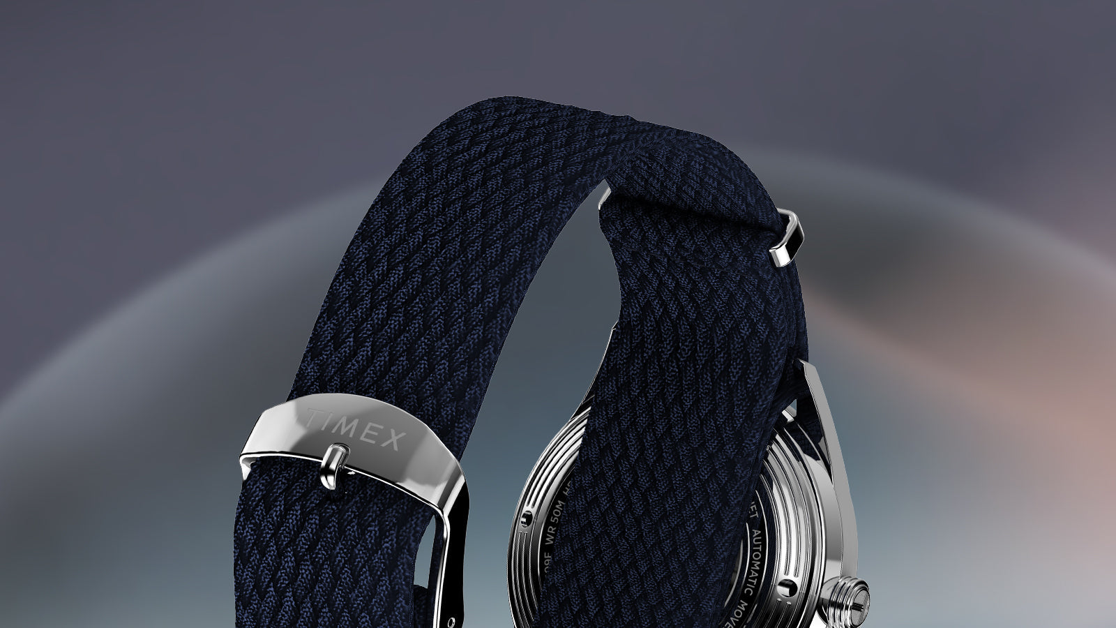 Rear view of Timex Marlin Jet Automatic showing navy woven strap with stainless-steel buckle engraved with Timex logo.