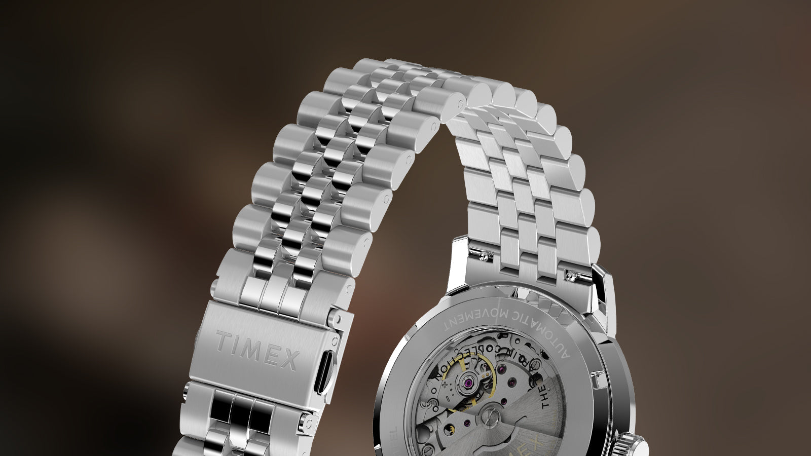Rear view of Timex Marlin Automatic showing polished stainless-steel caseback with open-heart movement and silver bracelet.