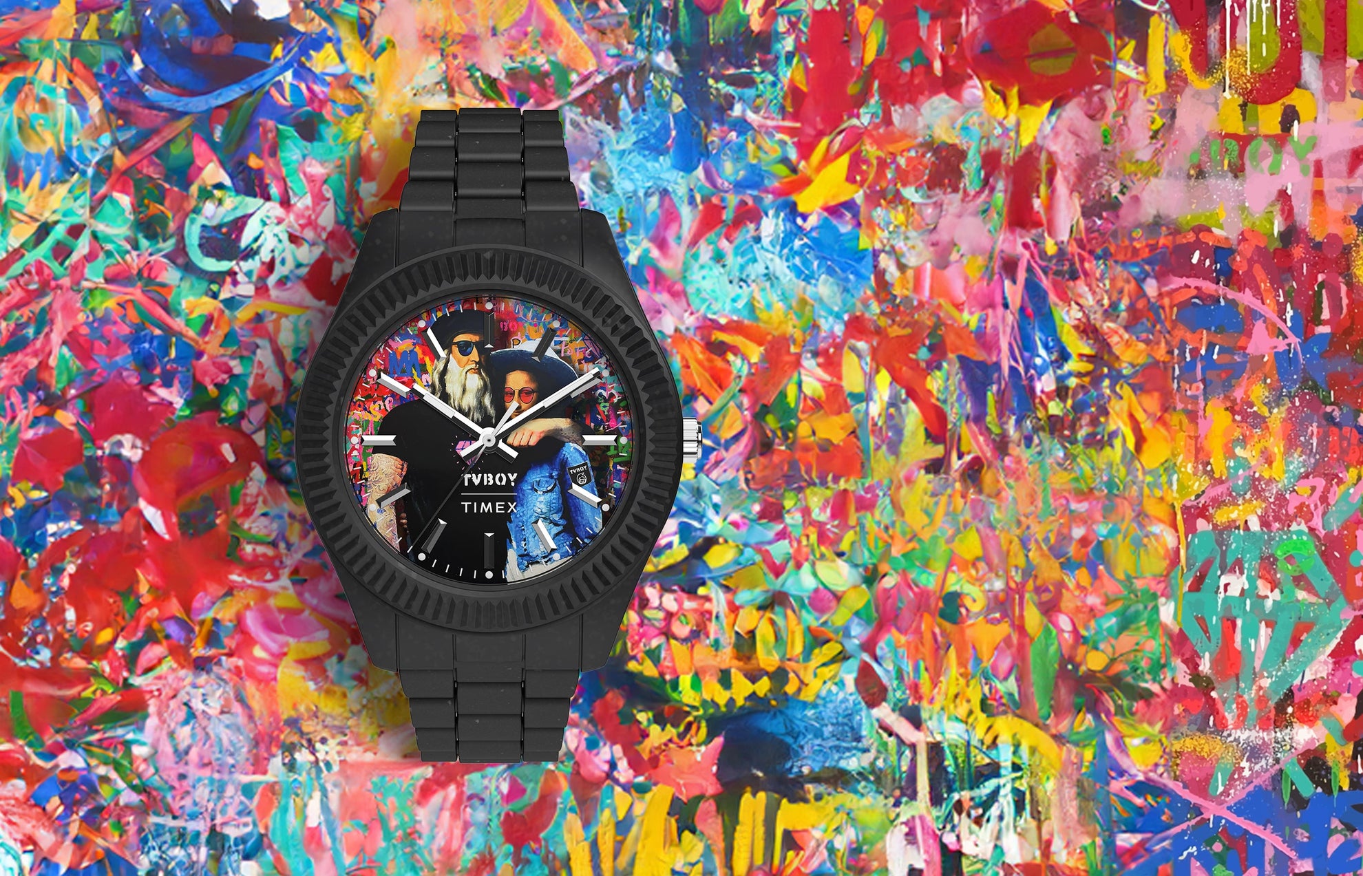 Timex Legacy Ocean x TVBOY watch with a matte black case and bracelet made from #tide ocean material. The colorful watch dial features a graffiti-style artwork of two figures against a vibrant, multicolored background symbolizing creativity and modern street art.