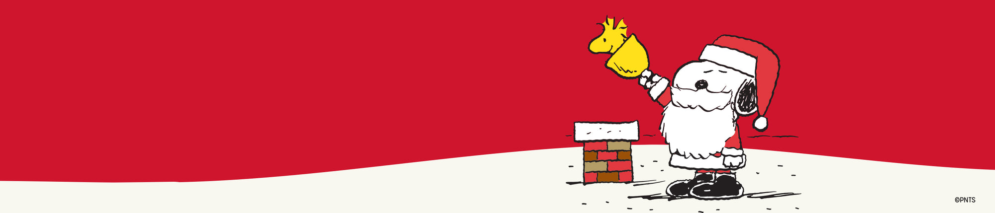 Snoopy dressed as Santa stands beside a small brick chimney, holding Woodstock in the air against a red and white holiday-themed background.