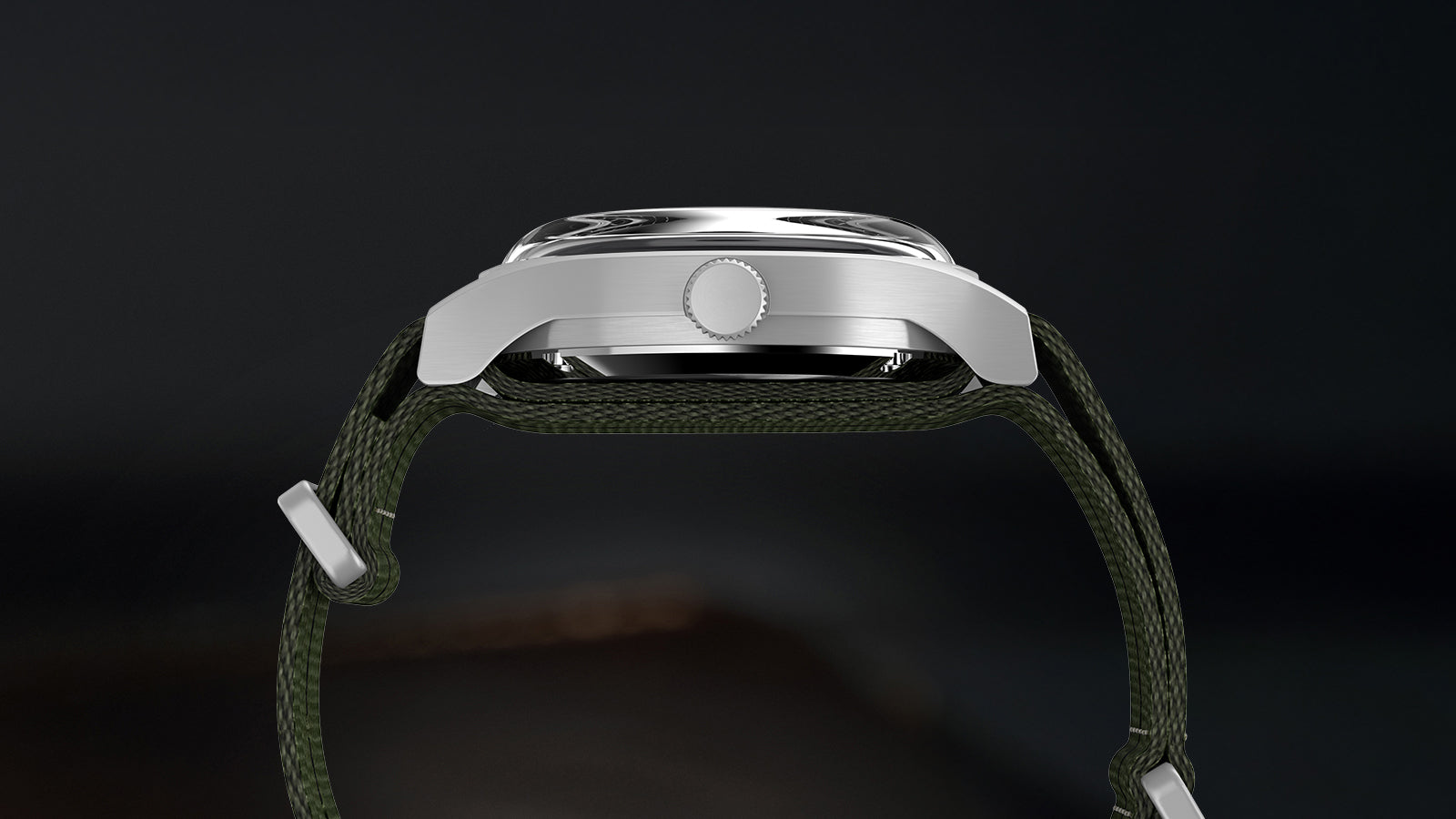 Side profile of Timex MK1 Automatic showing stainless steel case thickness and green fabric strap.