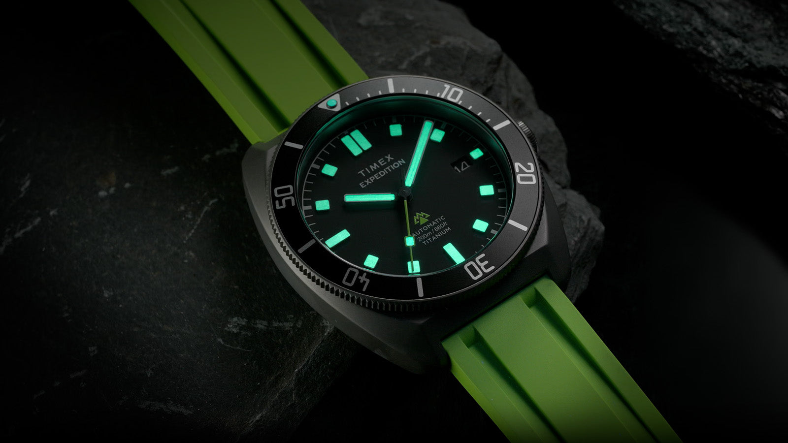 Night view of the Expedition® Pioneer Titanium Automatic emphasizing full lume on hands and markers.