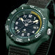 Timex Expedition® Freedive Solar watch with green resin case, black dial, yellow accents, and 50-meter water resistance on dark background.