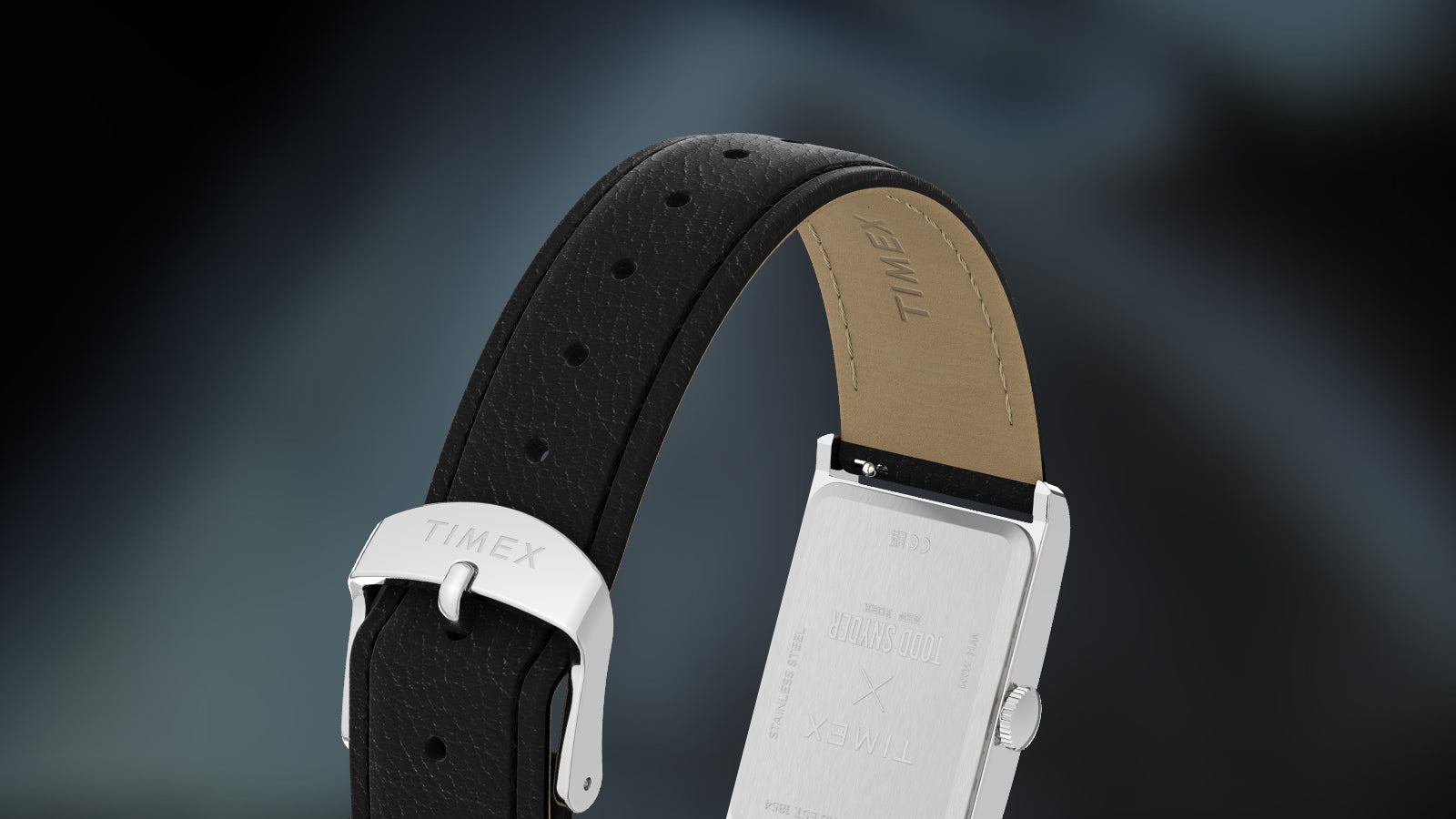 Rear view of the Timex x Todd Snyder 1976 Lexington watch showing the stainless steel case back and black leather strap with buckle.