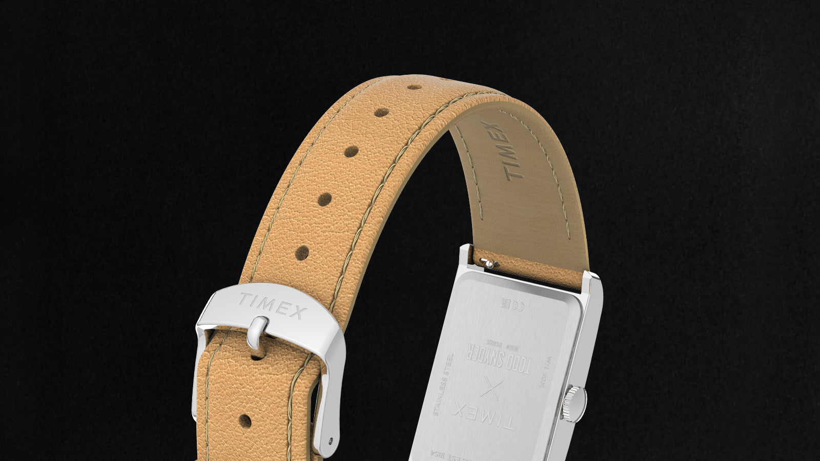 Rear view of the Timex x Todd Snyder 1976 Lexington watch showing the stainless steel case back and tan leather strap with buckle.