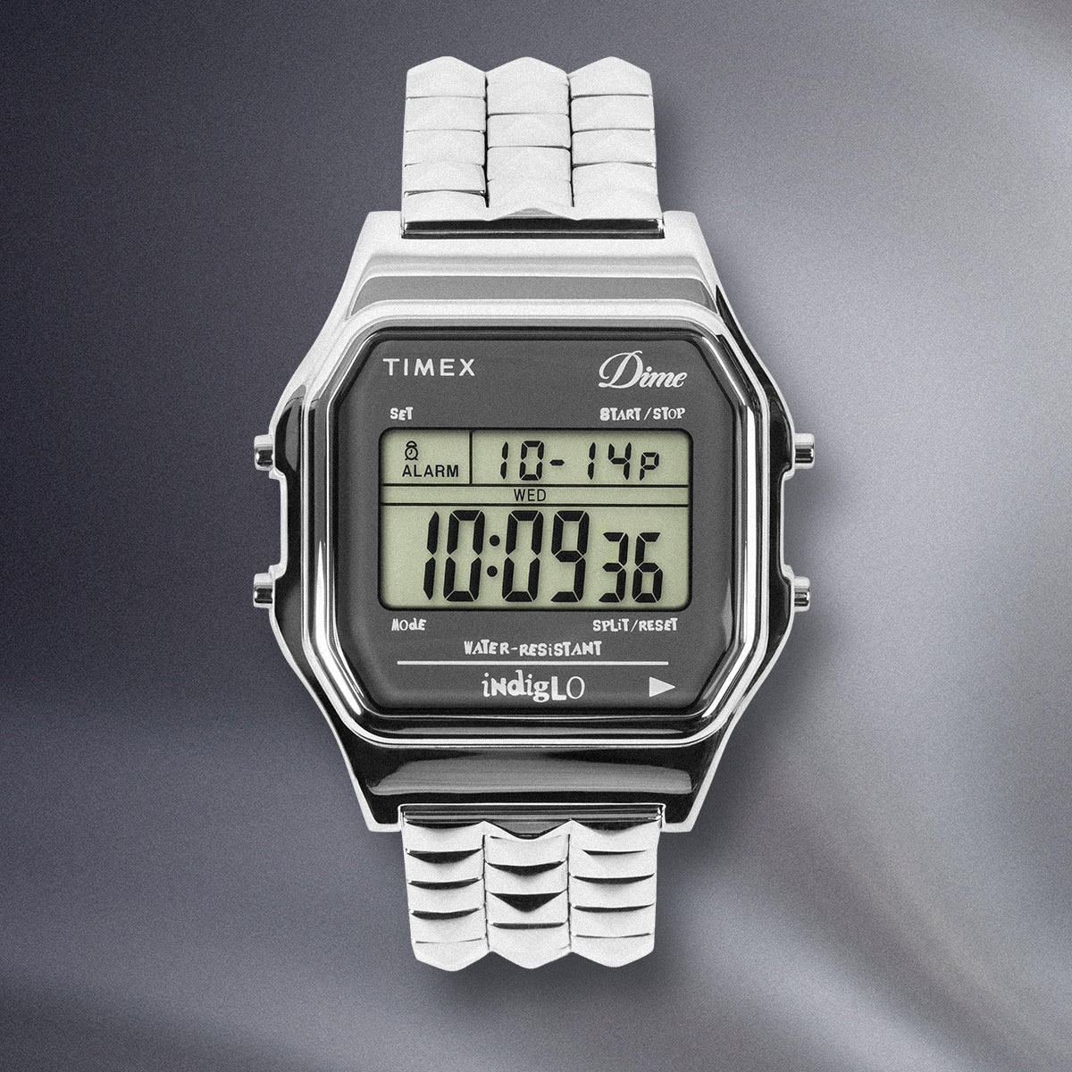 Timex x Dime digital watch with stainless steel pyramid-link bracelet and LCD display.