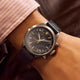 Timex Waterbury Ace Fly-Back Chronograph worn on wrist with black leather strap and brushed stainless steel case