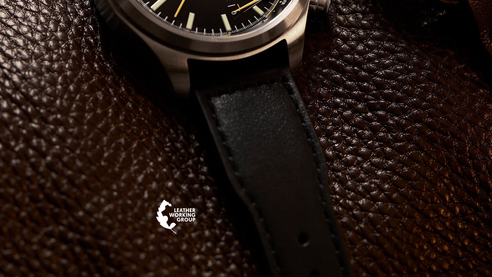 Timex Waterbury Ace Fly-Back Chronograph leather strap detail on textured brown leather surface with Leather Working Group logo