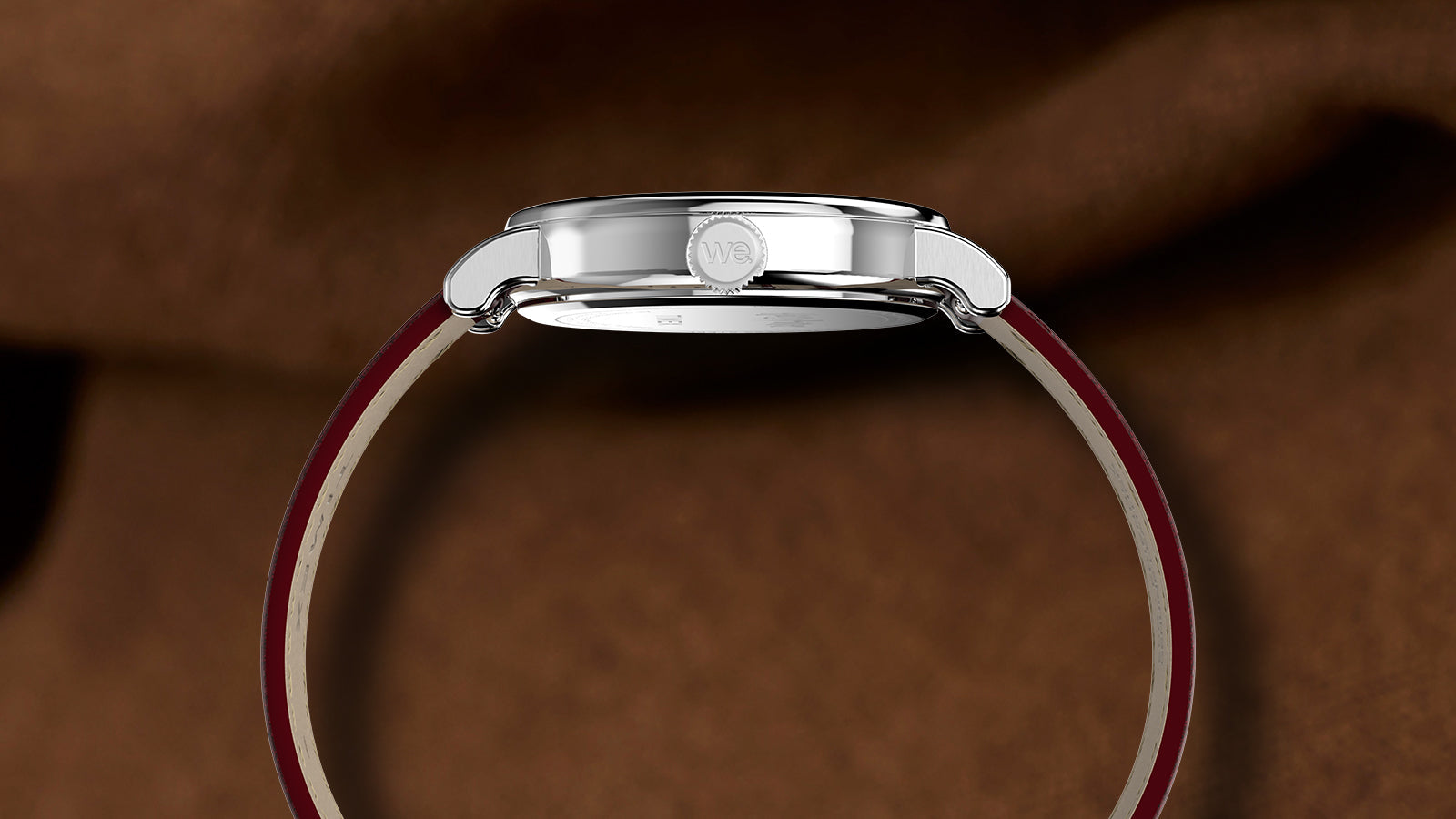 Side profile of Harry Potter x Timex Weekender Platform 9¾ watch showing slim stainless steel case and red leather strap.
