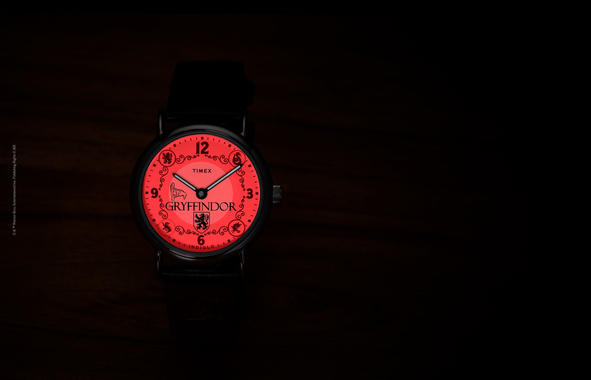 Harry Potter x Timex Weekender Gryffindor watch with red INDIGLO backlight showing Gryffindor name and crest.