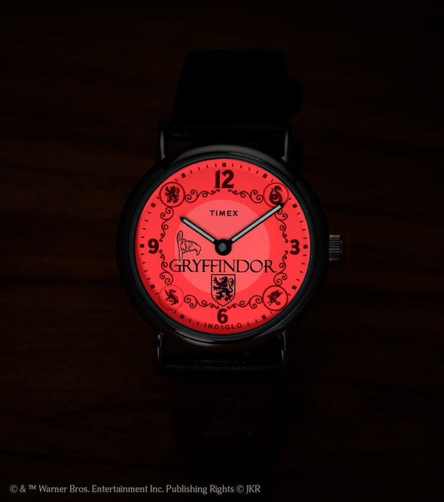 Harry Potter x Timex Weekender Gryffindor watch with red INDIGLO backlight showing Gryffindor name and crest.