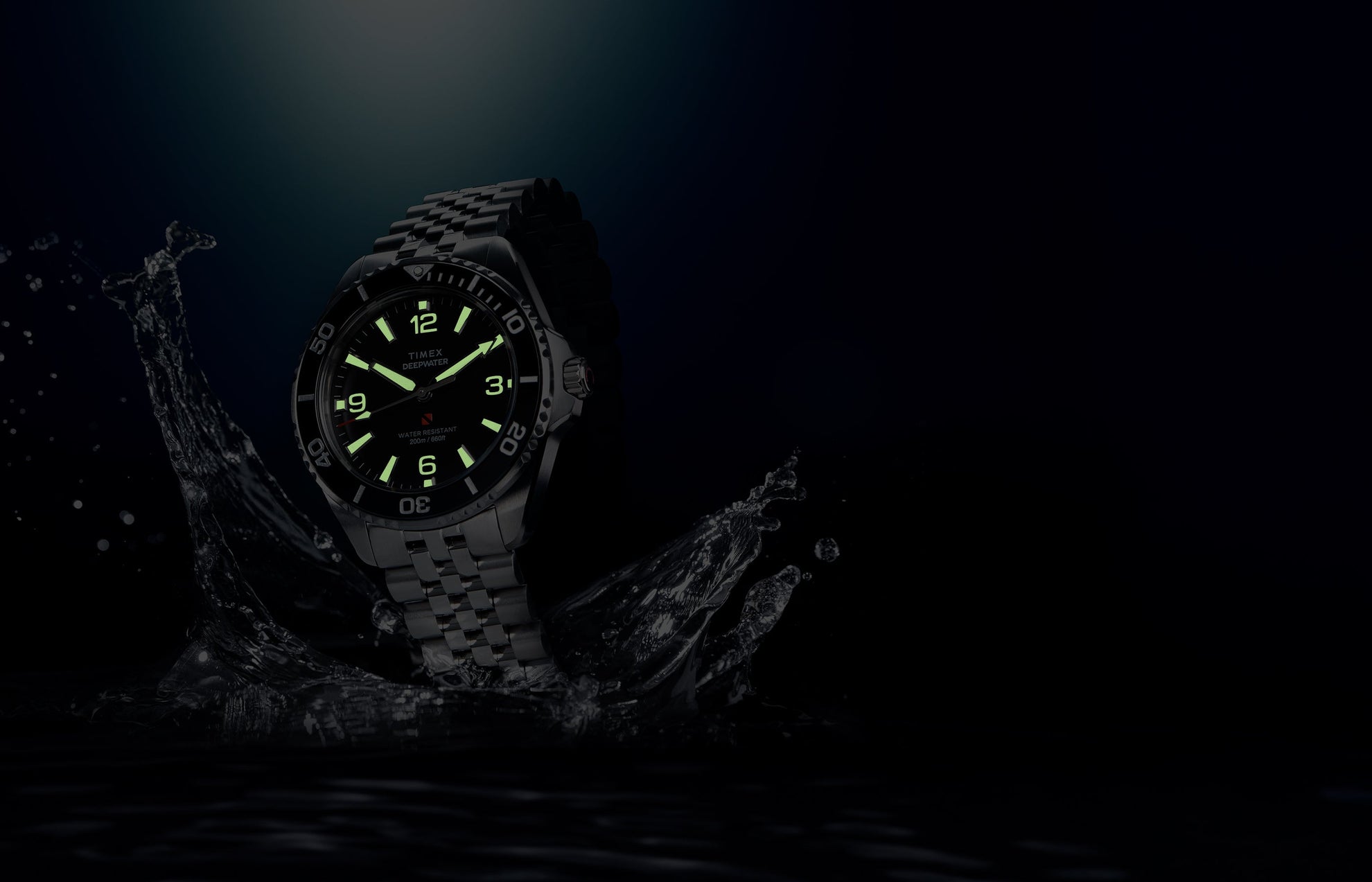 Timex Deepwater Arctic dive watch with glowing lume markers and hands in low light