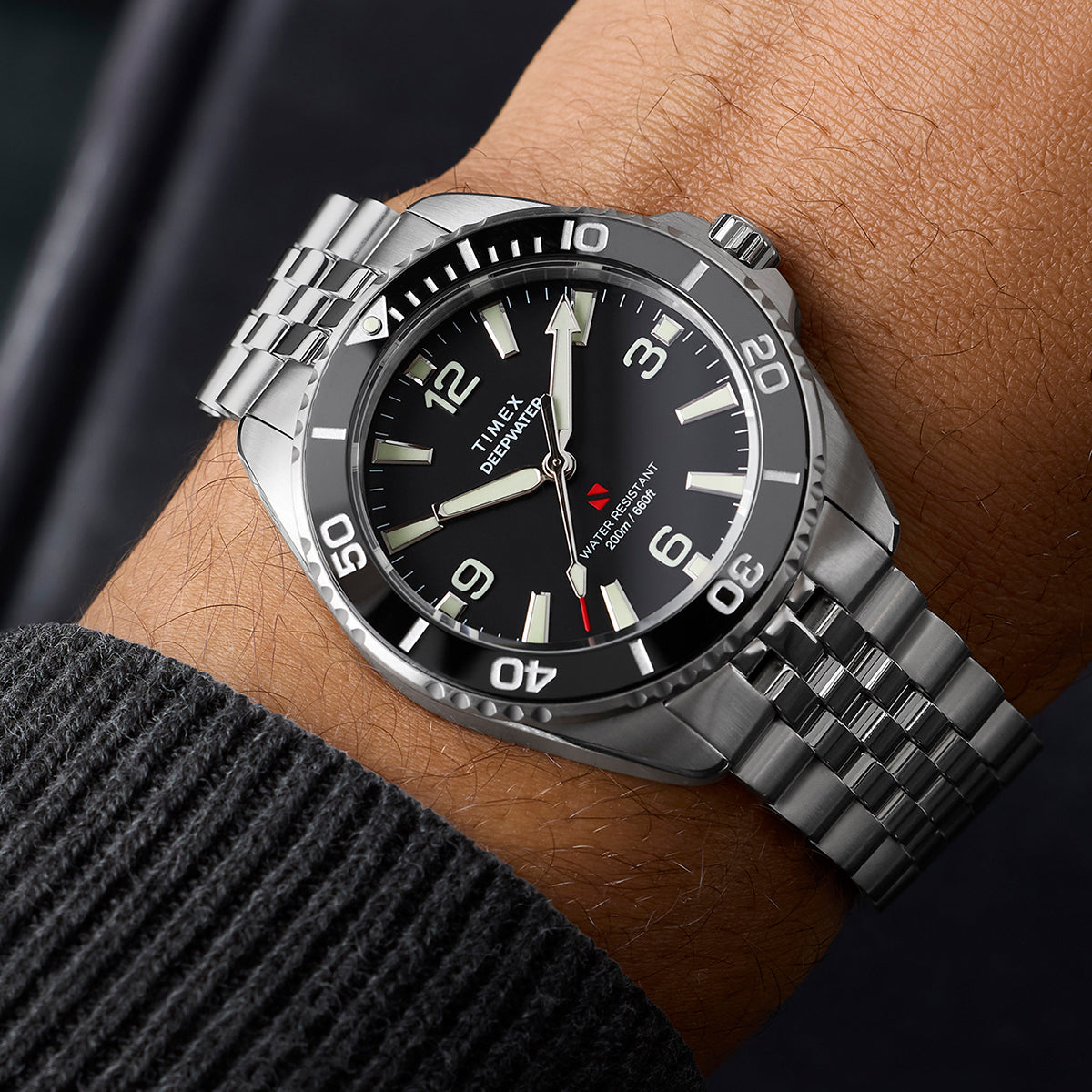 Timex Deepwater Arctic stainless steel watch worn on wrist with black dial and dive bezel