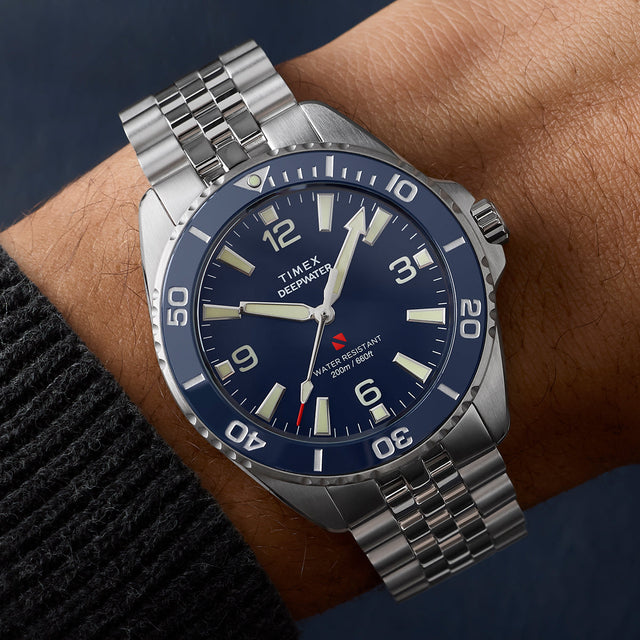 Timex Deepwater Arctic blue dial stainless steel watch worn on wrist with rotating bezel