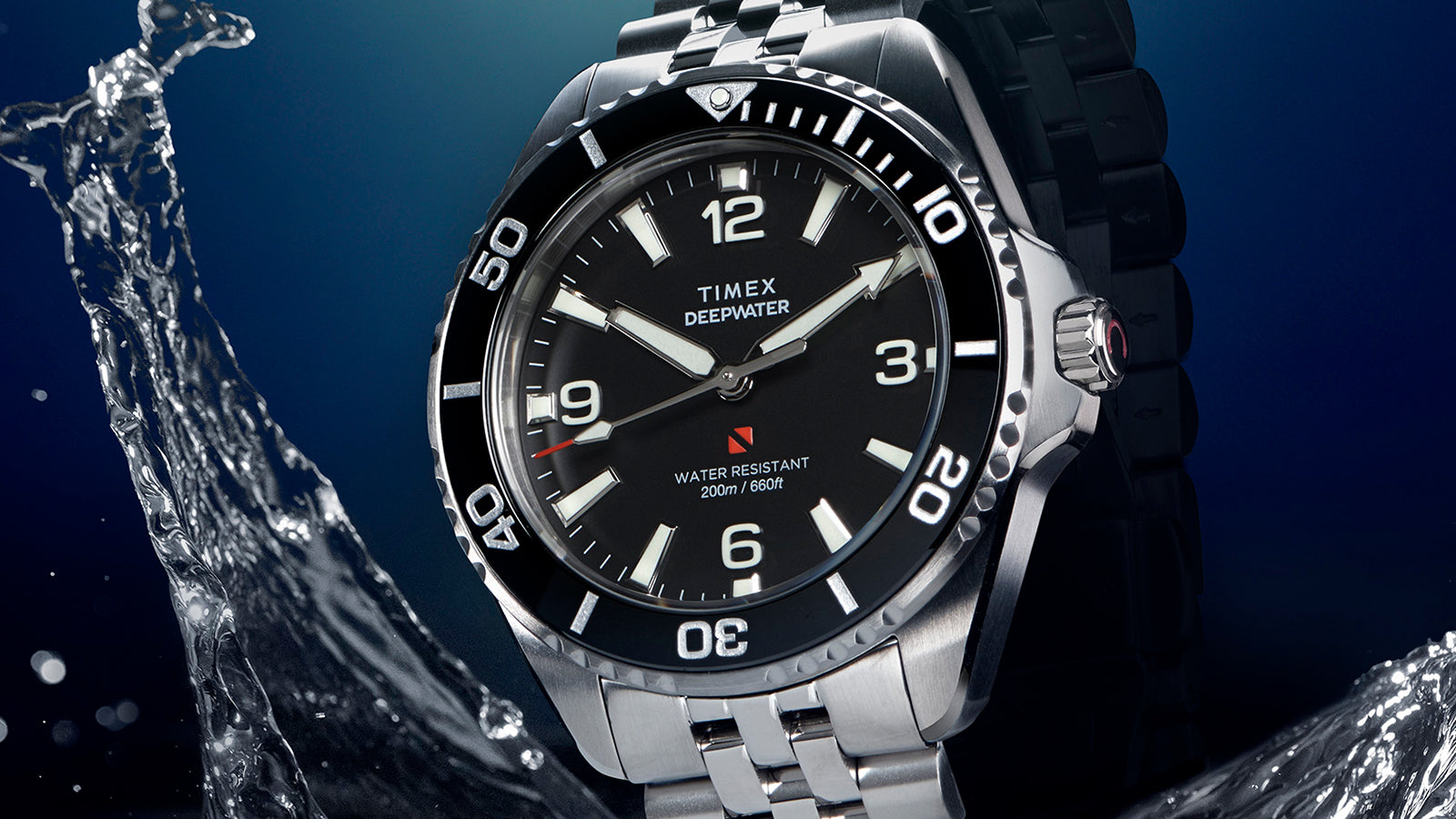 Angled view of Timex Deepwater Arctic dive watch with stainless steel bracelet and water splash