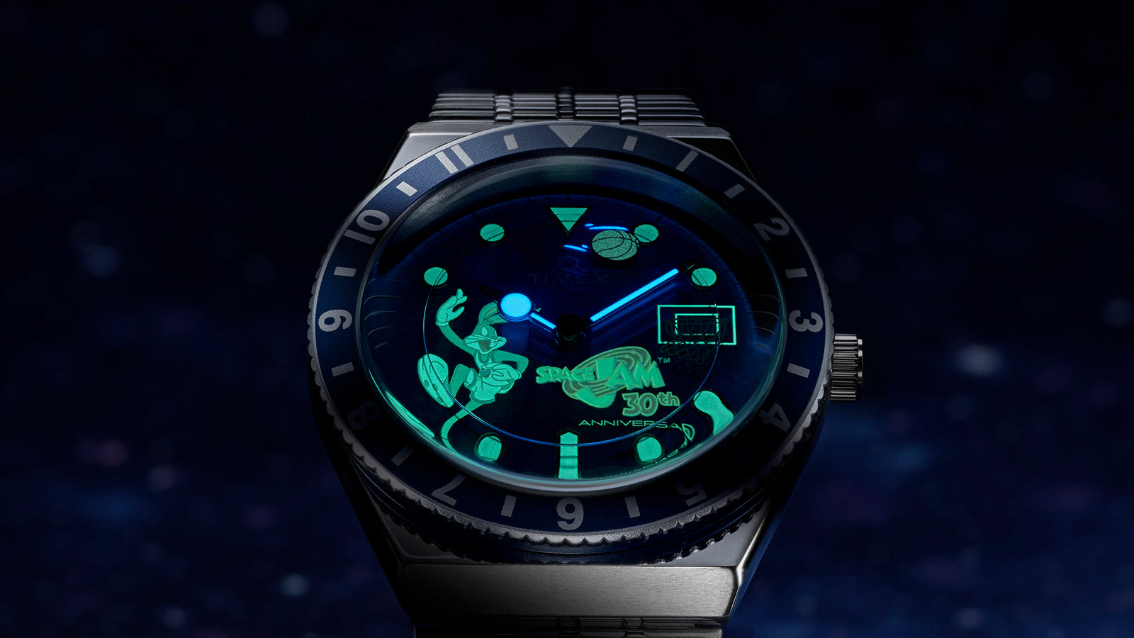 Close-up of Space Jam x Timex Q watch glowing in the dark with luminous Bugs Bunny illustration and basketball-themed markers