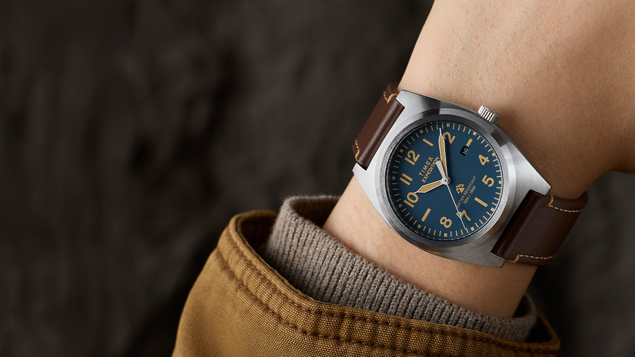 Timex Expedition Capstone watch on wrist with blue dial and brown leather strap