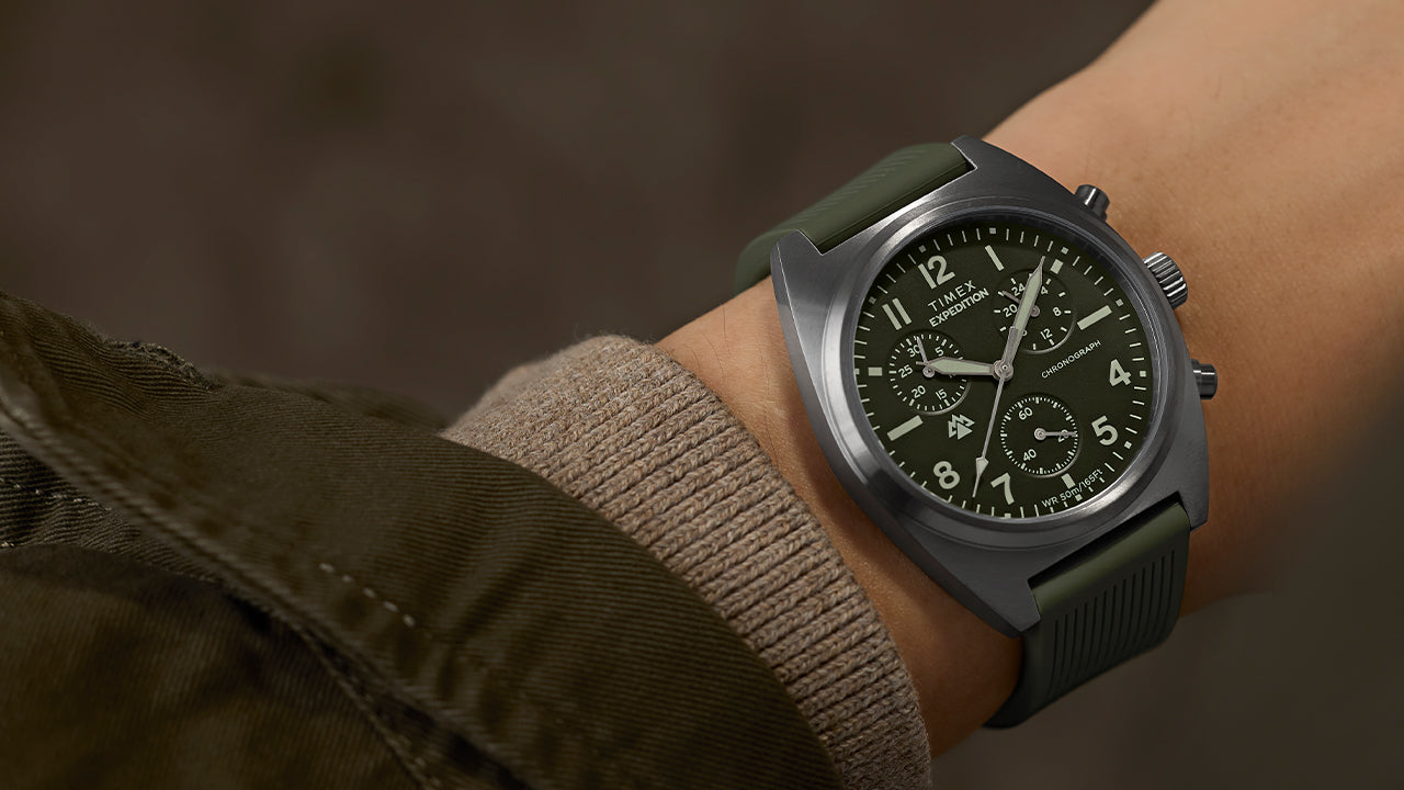 Timex Expedition Capstone Chronograph watch on wrist with green dial and green rubber strap