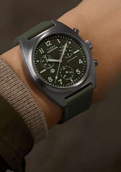 Timex Expedition Capstone Chronograph watch on wrist with green dial and green rubber strap