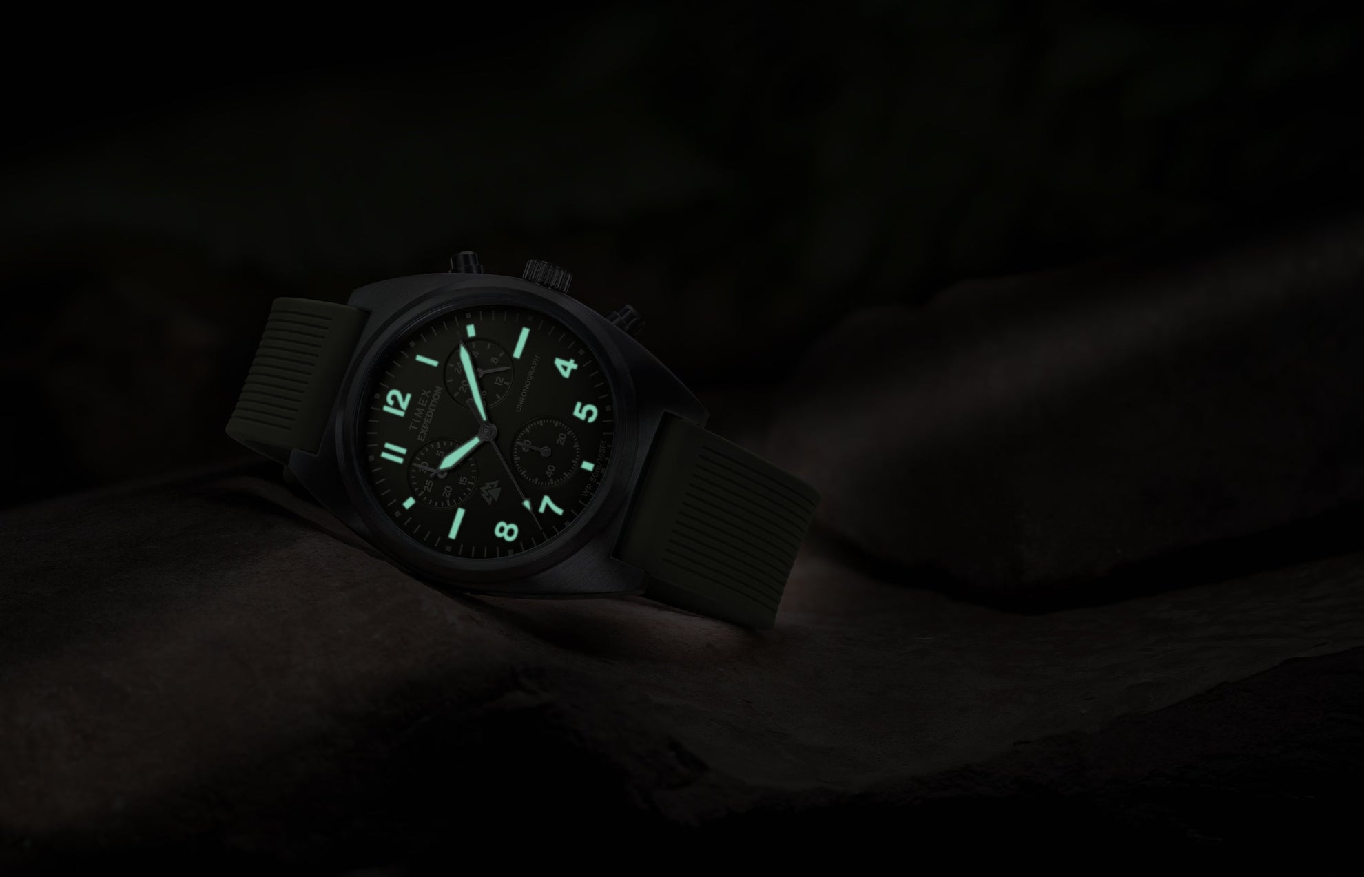 Timex Expedition Capstone Chronograph with glowing lume markers and hands in low light