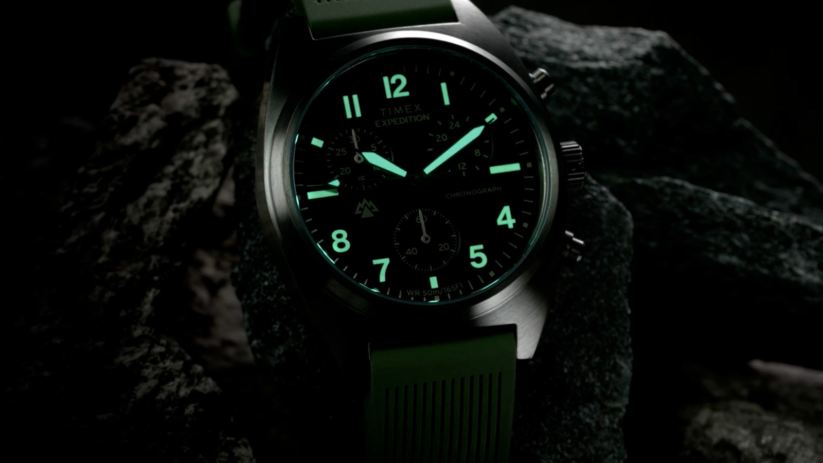 Close-up of Timex Expedition Capstone Chronograph dial with illuminated hands and markers