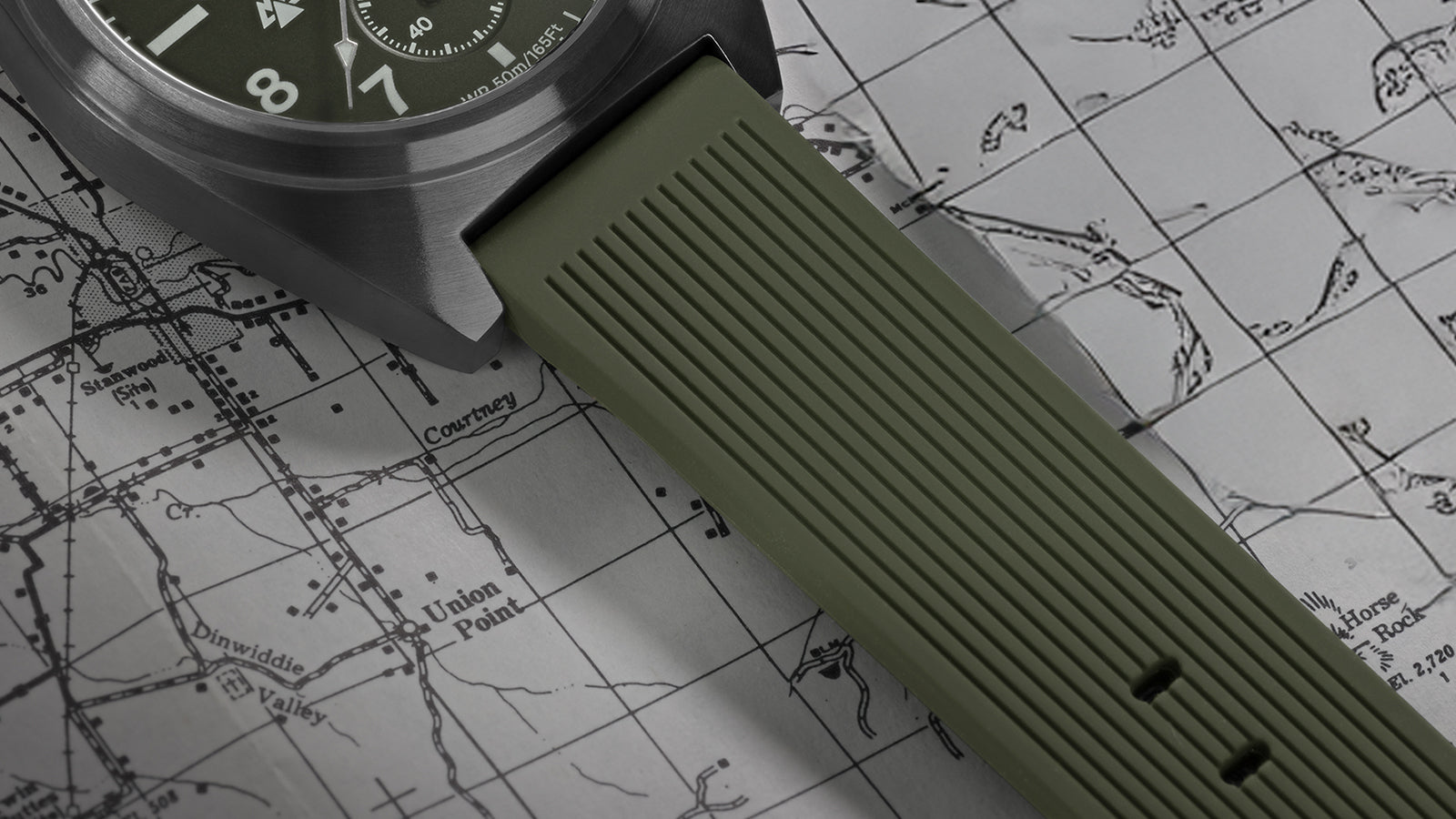 Timex Expedition Capstone Chronograph green rubber strap detail on map background